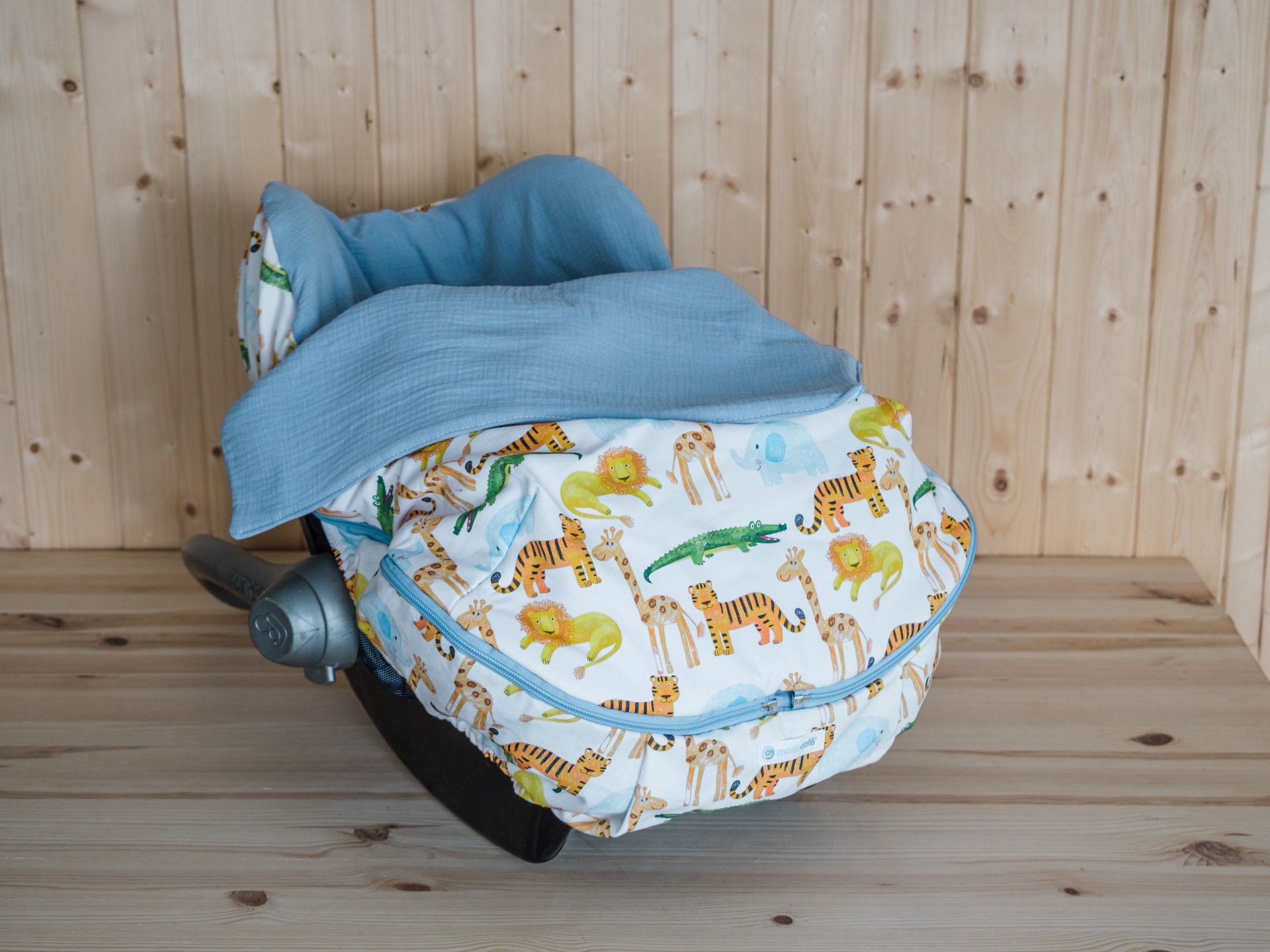 Forra OVO Jungle Cadeira de carro para bebé com capa de animais e parte superior azul