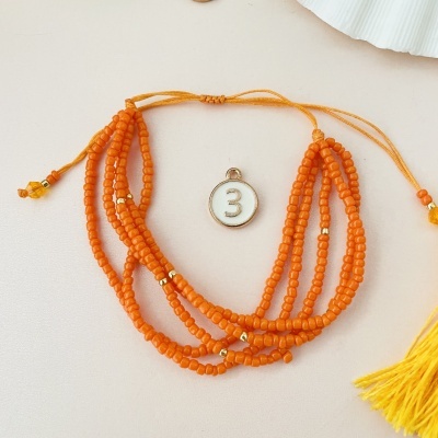 Pulseira de contas laranja com pendente número 3
