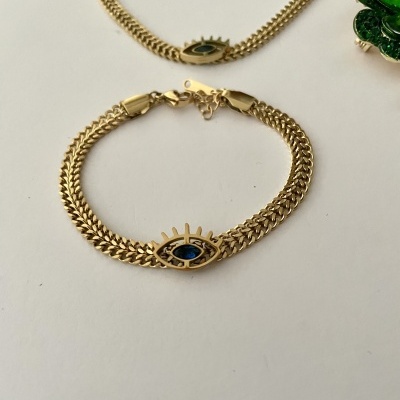 Pulseira dourada com pendente em forma de olho azul