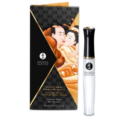 Brilho labial Shunga Divine Oral Pleasure Gloss em tubo branco com tampa preta ao lado da embalagem preta decorada com ilustração artística de casal.