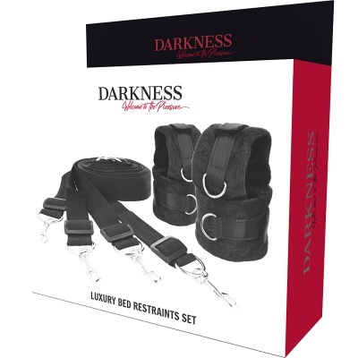 Conjunto de restrições de cama de luxo Darkness com tiras e algemas pretas em embalagem preta, vermelha e branca.