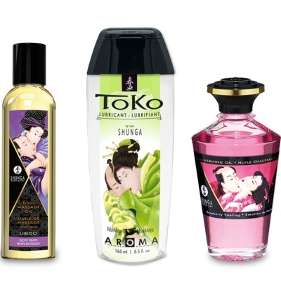 Três produtos Shunga para uso erótico em frascos com rótulos ilustrados.