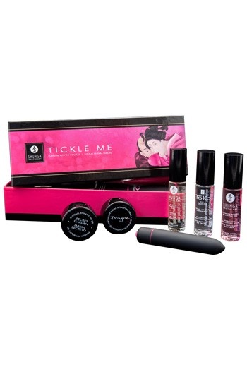 Conjunto de produtos eróticos Shunga com líquidos, cremes e vibrador em caixa rosa e preta.