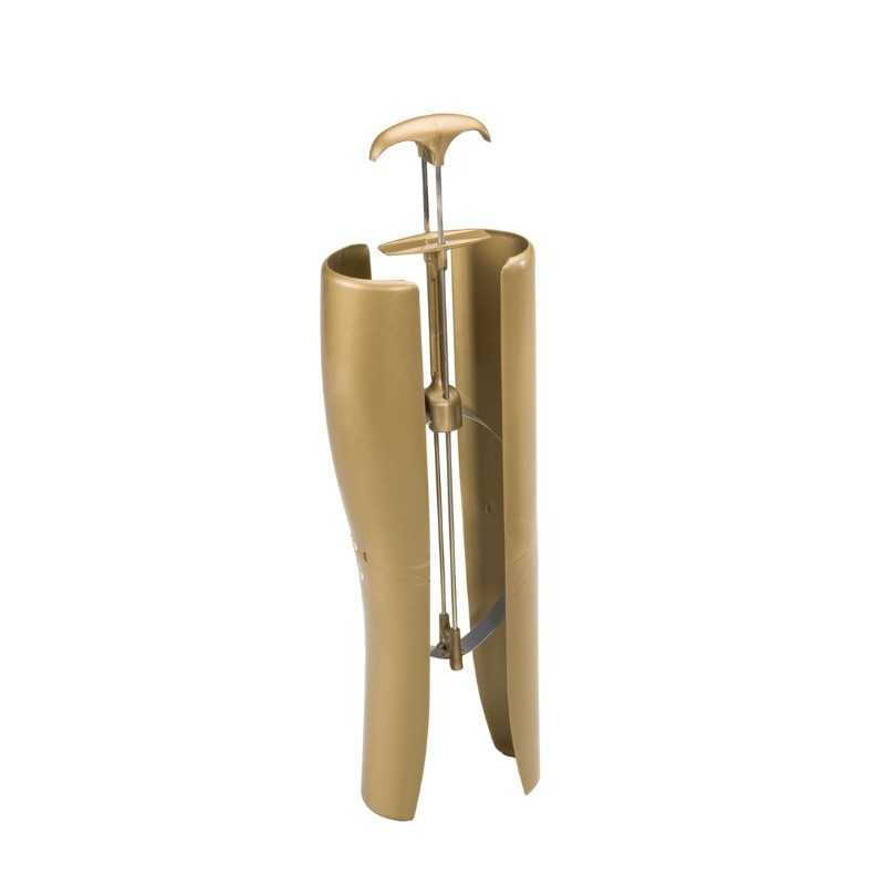 Dispositivo dourado para esticar sapatos com estrutura metálica e pegador em T