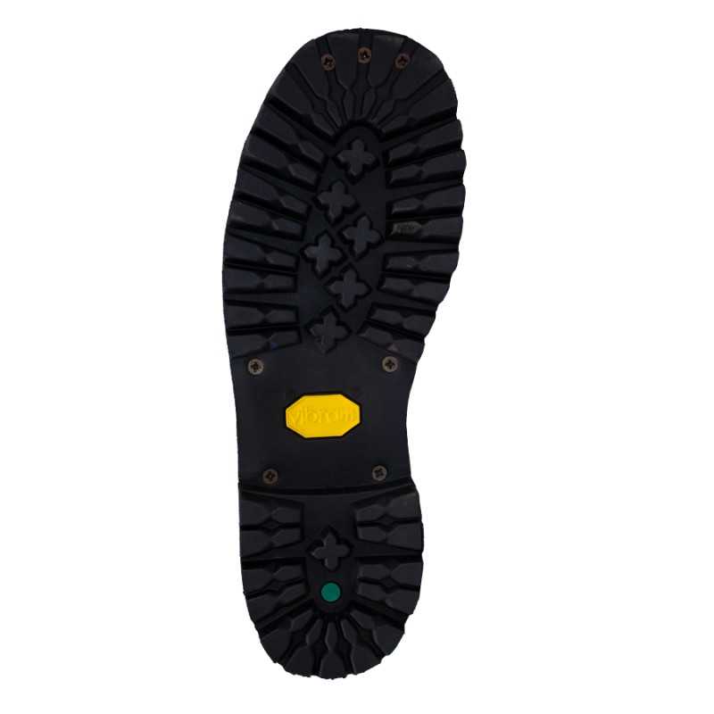 Sola de sapato preta com etiqueta amarela Vibram