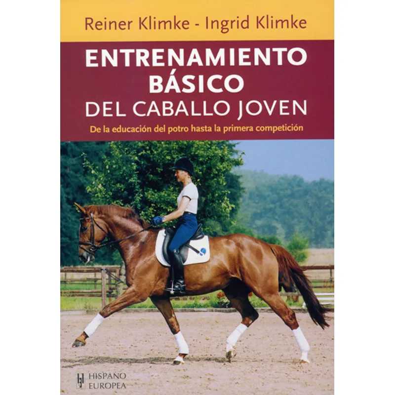 Livro sobre treino básico de cavalo jovem, com cavaleiro num cavalo castanho numa pista de equitação