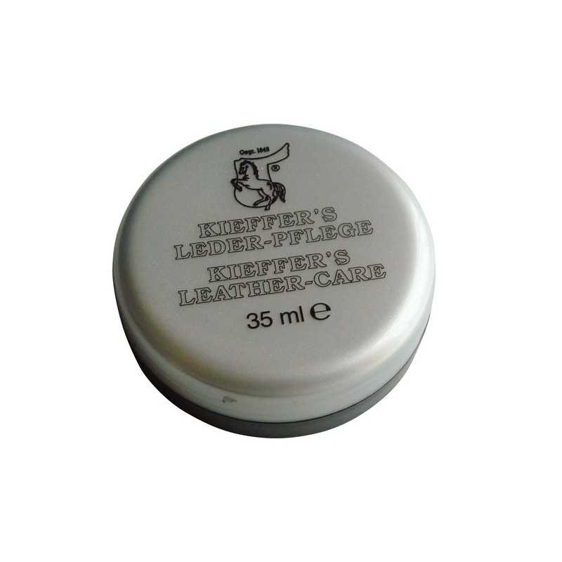 Contentor metálico prateado redondo para cuidado de couro com texto preto