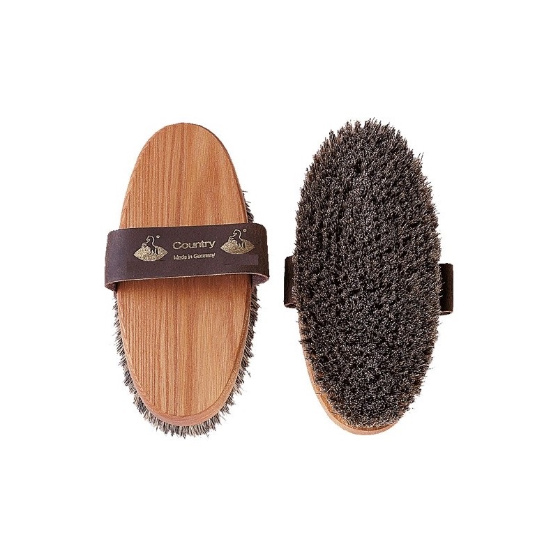 Escova oval de madeira com cerdas escuras e tira de couro castanha com texto