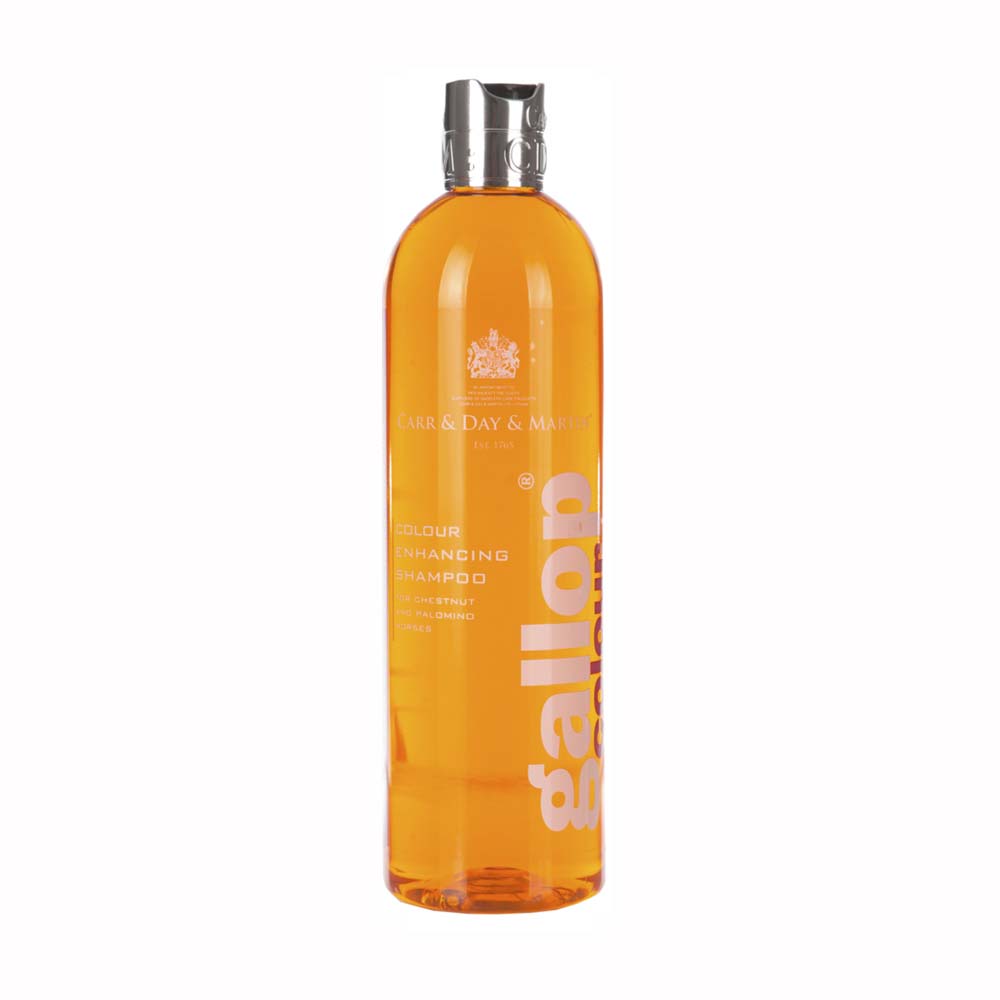 Garrafa de shampoo transparente laranja com tampa prateada e texto branco