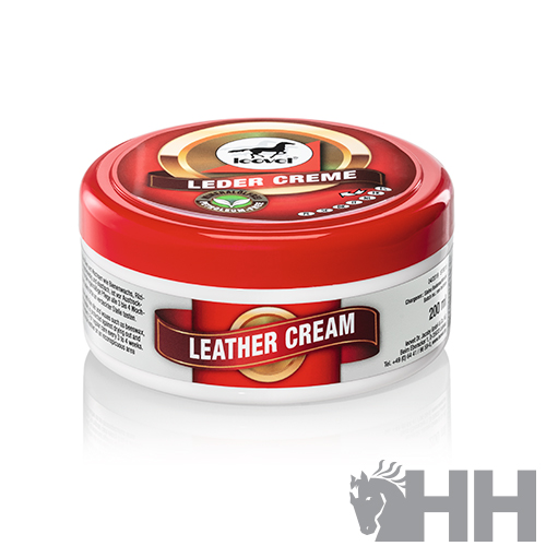 Creme para couro em embalagem redonda com tampa vermelha e rótulo com texto LEATHER CREAM