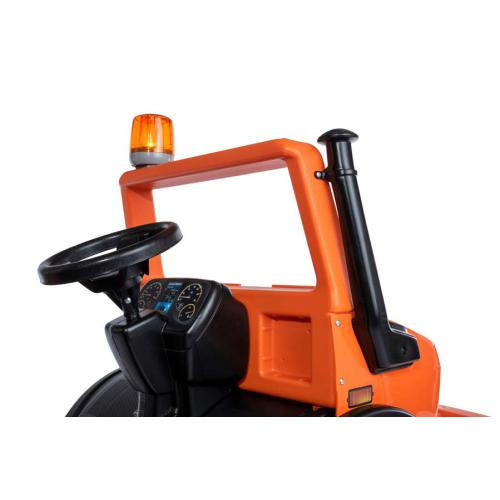 Trator de brinquedo laranja com volante preto e luz amarela