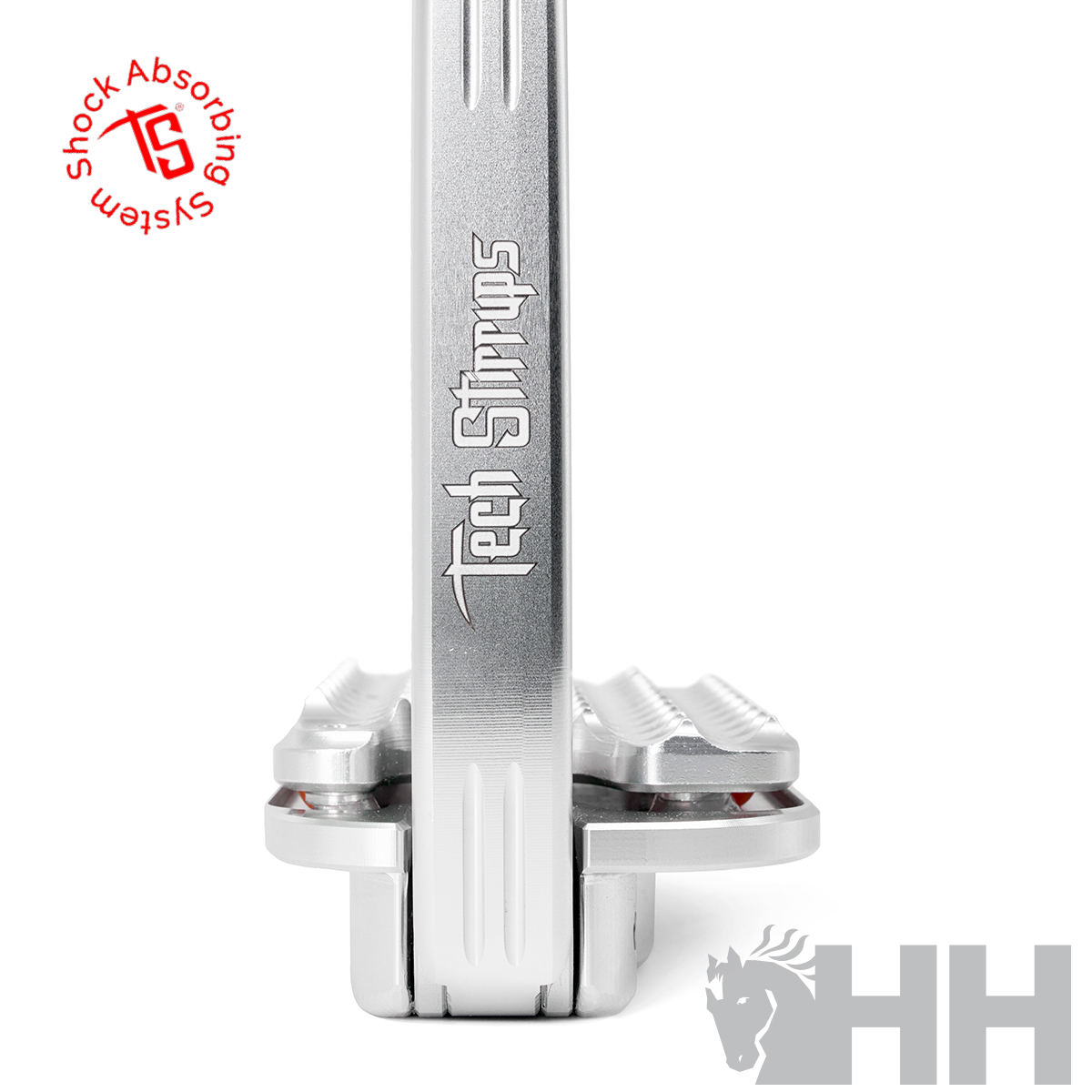 Aparelho técnico prateado com texto 'Tech Straps' e selo vermelho