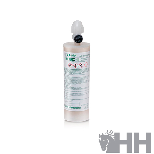 Frasco cilíndrico branco com tampa e etiqueta com texto verde e preto