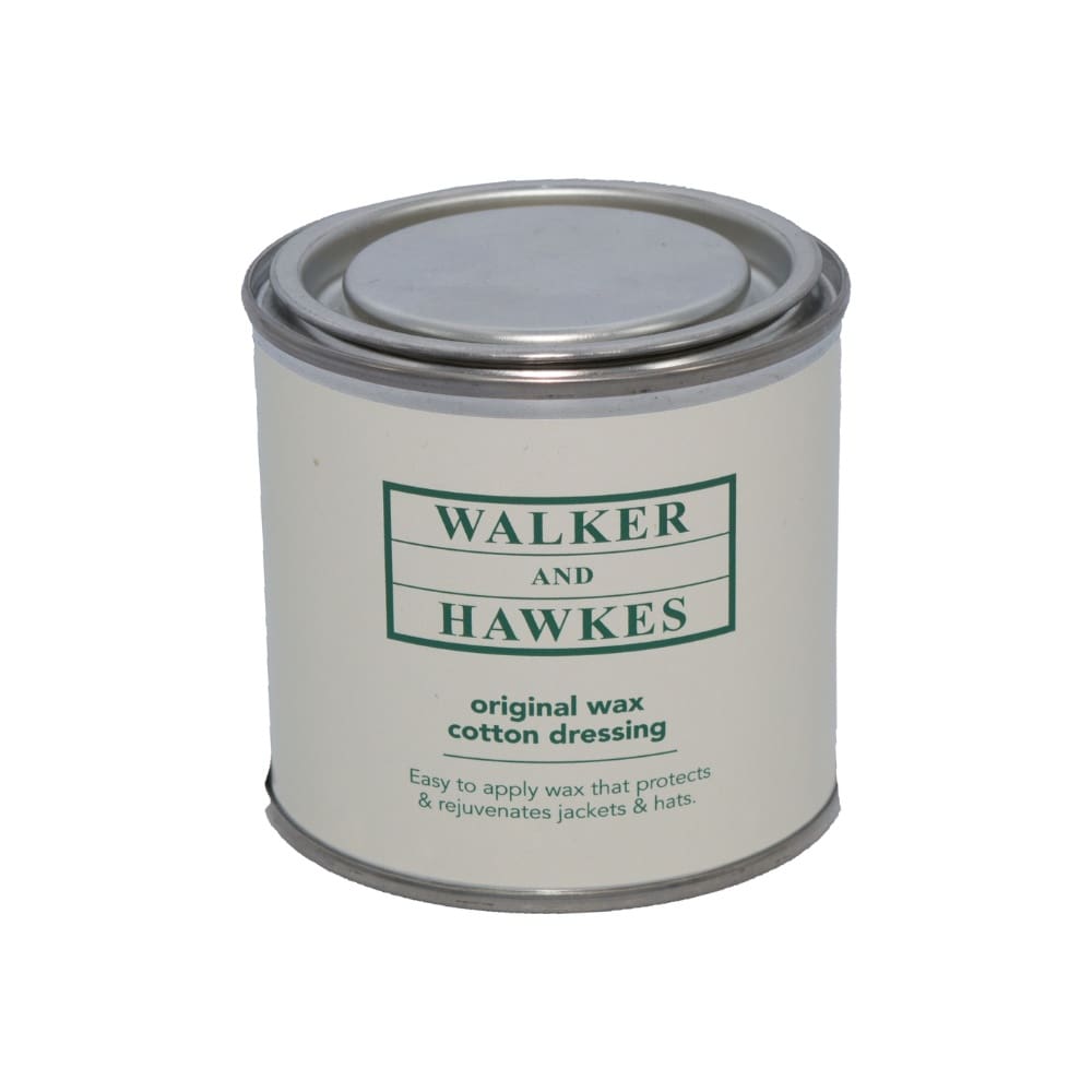 Lata metálica de cera original para roupa de algodão com rótulo branco e texto verde.