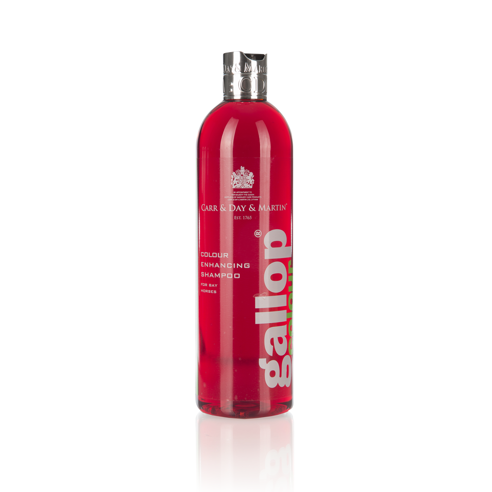 Frasco de shampoo vermelho translúcido com tampa prateada e rótulo branco