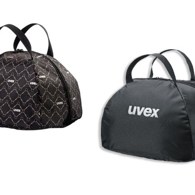 Duas capas de capacete UVEX com alças, uma preta com padrão geométrico e outra preta lisa