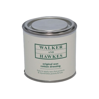 Lata metálica de cera original para roupa de algodão com rótulo branco e texto verde.