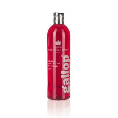 Frasco de shampoo vermelho translúcido com tampa prateada e rótulo branco