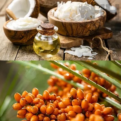 Cocos partidos, lascas de coco, óleo em frasco de vidro com rolha, juntamente com ramos de bagas laranjas em fundo natural