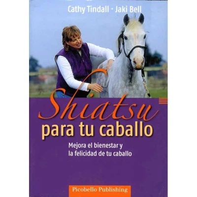 Livro sobre shiatsu para cavalos com imagem de mulher a tocar cavalo branco