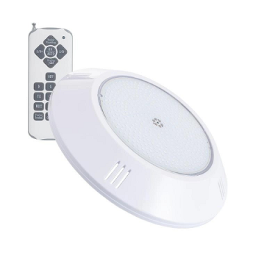 Luz de teto redonda com controlo remoto numa superfície branca