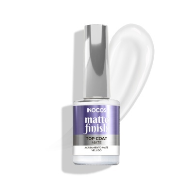 Frasco de verniz Inocos matte finish com tampa prateada sobre fundo branco com mancha de verniz.