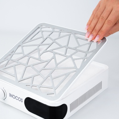 Dispositivo branco retangular com tampo metálico geométrico e filtro interno com botão e texto INOCOS