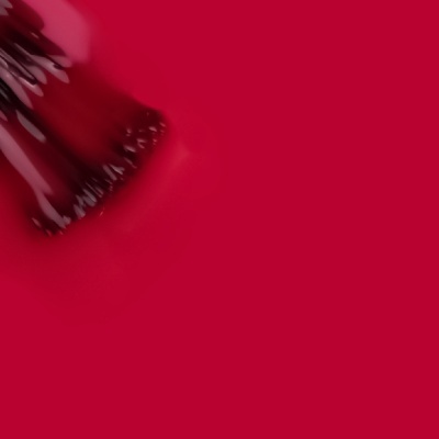 Pincel de maquilhagem com cerdas pretas e cabo vermelho sobre fundo vermelho