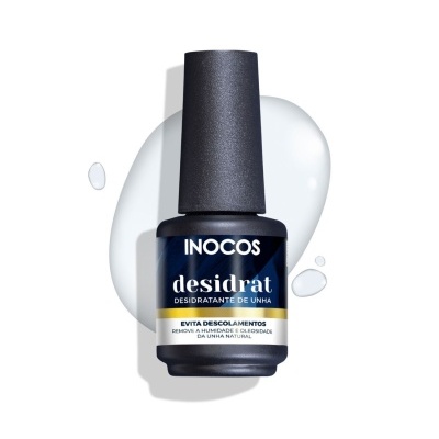 Frasco de desidratante de unha da marca INOCOS com texto e gotas líquidas em fundo branco.