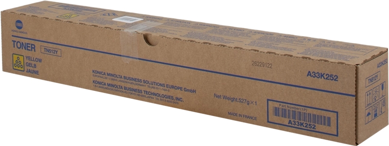 Embalagem de toner Konica Minolta amarela em caixa de papelão castanho