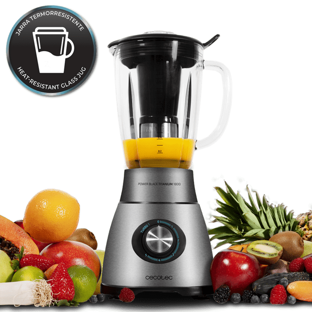 Liquidificador metálico com jarra de vidro e frutas