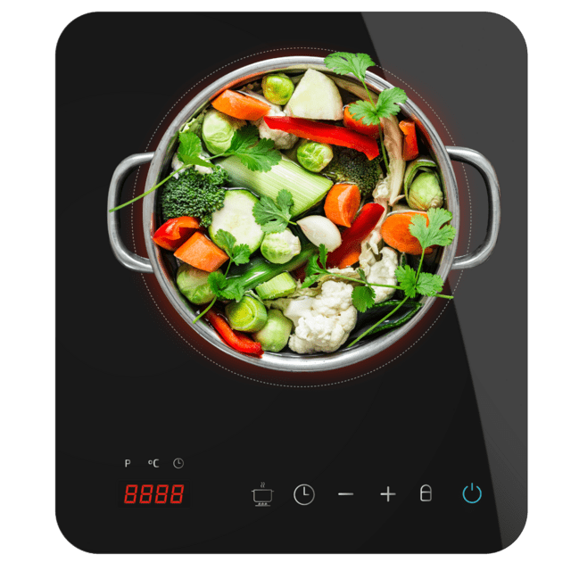 Placa de indução preta com tacho de inox e legumes coloridos