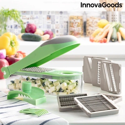 Utensílio de cozinha para cortar legumes verde e cinza com lâminas intercambiáveis e recipiente transparente.
