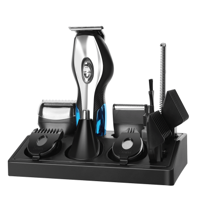 Aparelho de barba e cabelo elétrico com acessórios numa base preta
