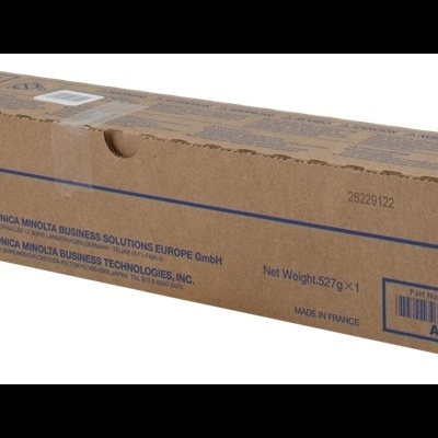 Embalagem de toner Konica Minolta amarela em caixa de papelão castanho