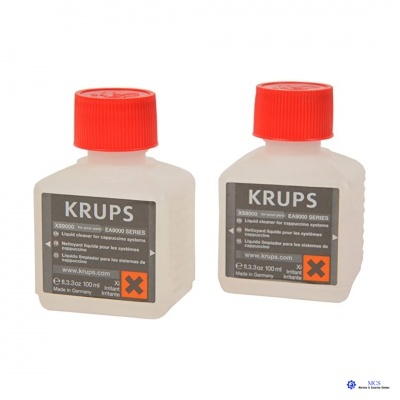 Duas embalagens de líquido de limpeza KRUPS com tampa vermelha e etiquetas cinza