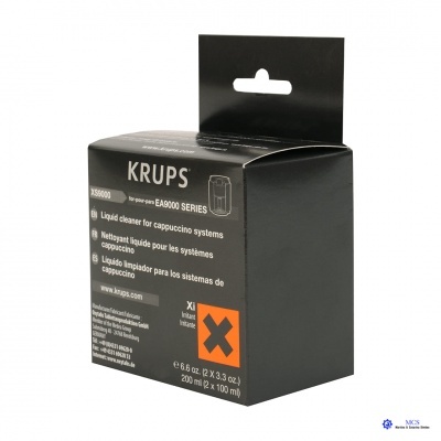 Embalagem preta do produto KRUPS para limpeza de sistemas de cappuccino com texto multilíngue e símbolo de advertência