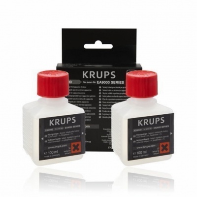 Duas garrafas brancas KRUPS com tampas vermelhas e embalagem preta EA9000 SERIES