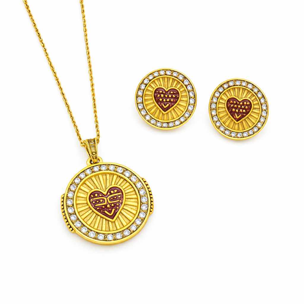 Conjunto de joias douradas com coração vermelho e pedras brancas