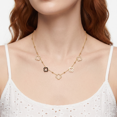 Colar dourado com pendentes em forma de trevo em madrepérola e preto