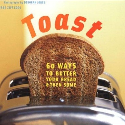 Livro Toast com uma fatia de pão torrado num tostador
