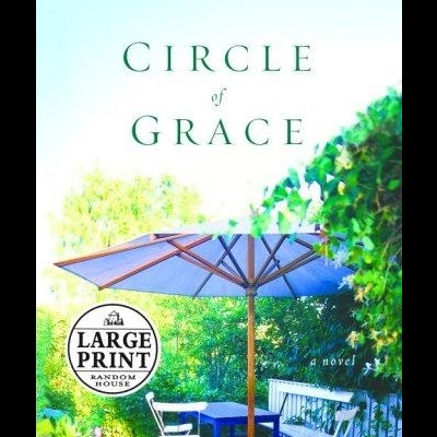Capa do livro Circle of Grace com mesa e cadeiras num jardim com guarda-sol azul