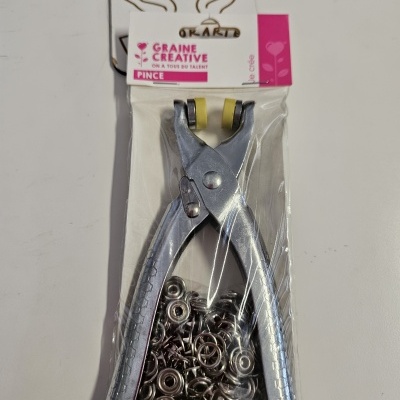 Eina metàl·lica platejada amb peces petites en embalatge de plàstic amb etiqueta GRAINE CREATIVE