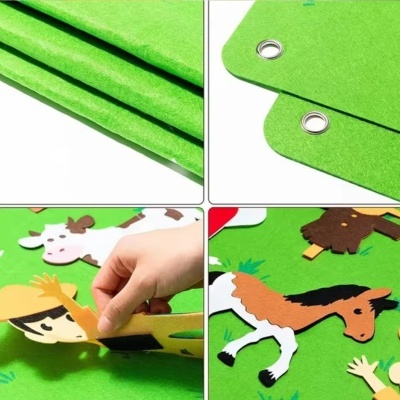 Painéis pretos de feltro verde com animais de quinta e figuras humanas de feltro para atividades pedagógicas.