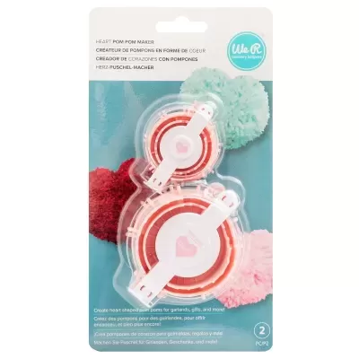 Kit para fazer pompons em forma de coração com componentes em plástico em embalagem azul