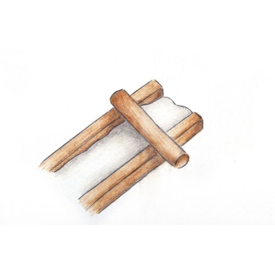 Três paus de canela castanhos sobre superfície branca