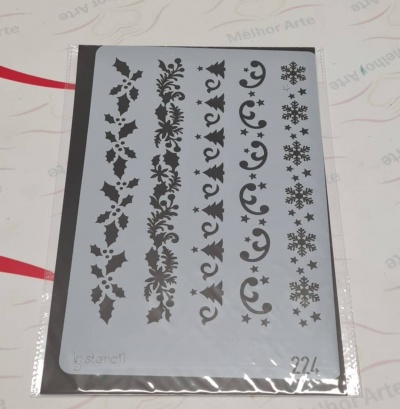 Stencil plástico com padrões decorativos em preto sobre fundo cinzento