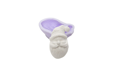 Molde de silicone roxo com figura de Pai Natal de gesso branco
