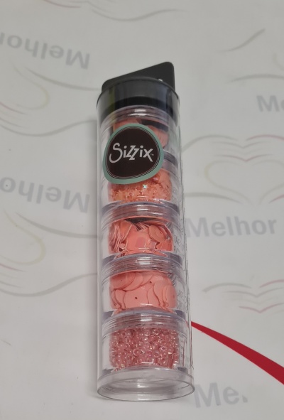 Frasco com compartimentos de confetes e miçangas rosa da marca Sizzix.