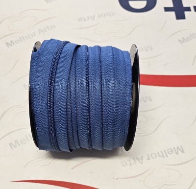 Carretel de zíper azul com textura em espinha de peixe